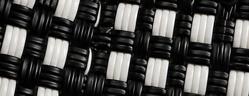 Close-up of the Black Tie Gala Bag woven pattern using 100% recycled plastic.