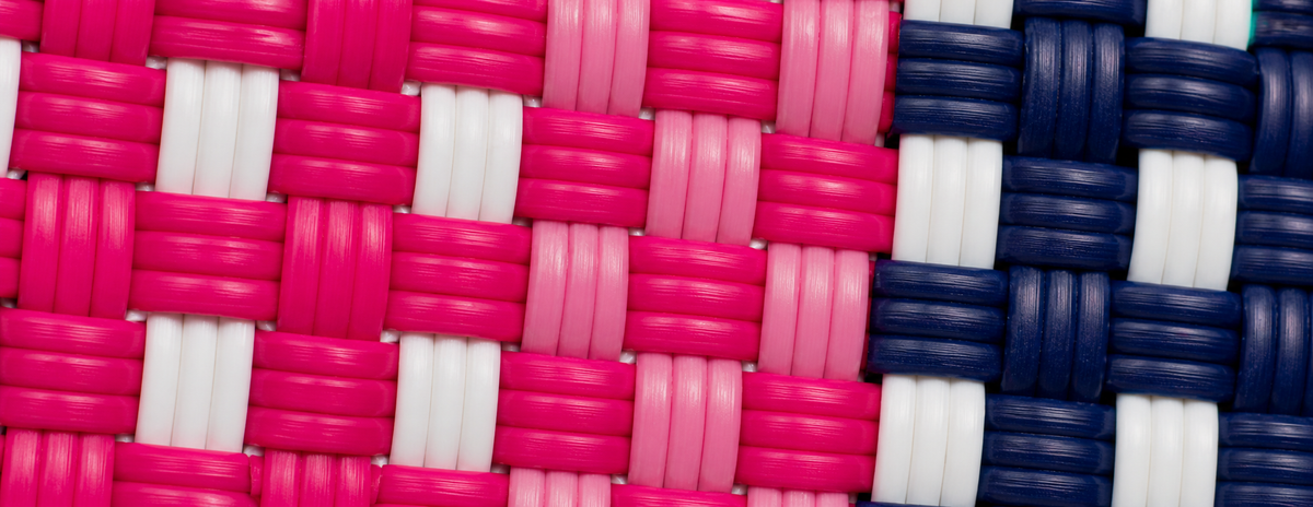 Close-up of a woven pattern with pink, white, and blue colors create the Candy Cane Gala Bag
