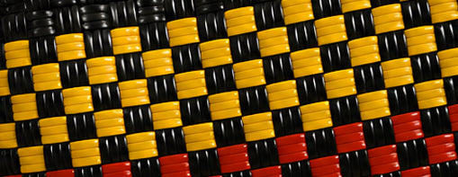 Close-up of the Red Earth Gala Bag woven pattern using 100% recycled plastic.