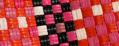 Close-up of the Sunset Gala Bag woven pattern using 100% recycled plastic.